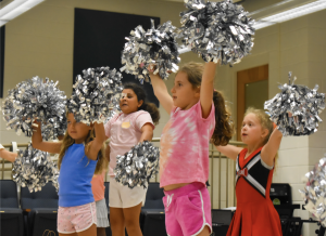 Campers trying out a variety of new and fun activities including cheerleading!